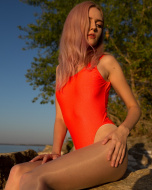 Sexy one piece swimsuit made with a super high leg and open back. 80% Polyamide 20% Lycra. Neon Coral Color.